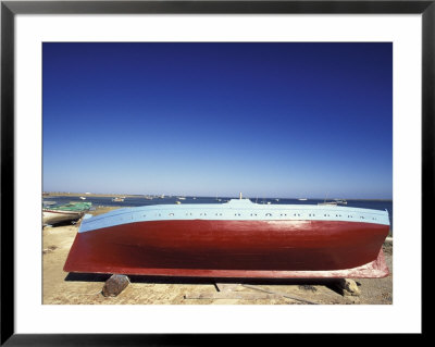 Traditional Felucca Fishing Boat On The Beach, Tunisia by Michele Molinari Pricing Limited Edition Print image