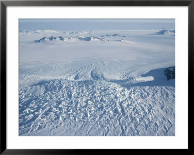 An Aerial View Of Crevasses In A Polar Glacier On Antarctica by Gordon Wiltsie Pricing Limited Edition Print image
