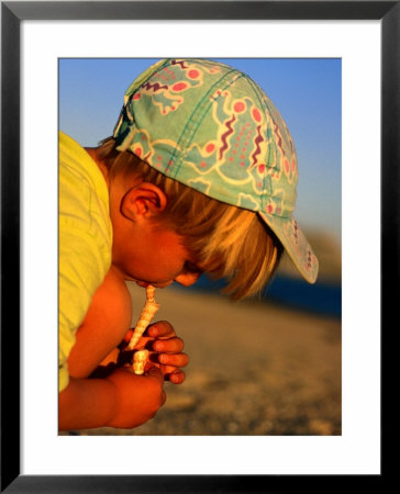 Boy Playing With Shells, Baja, Mexico by Philip & Karen Smith Pricing Limited Edition Print image