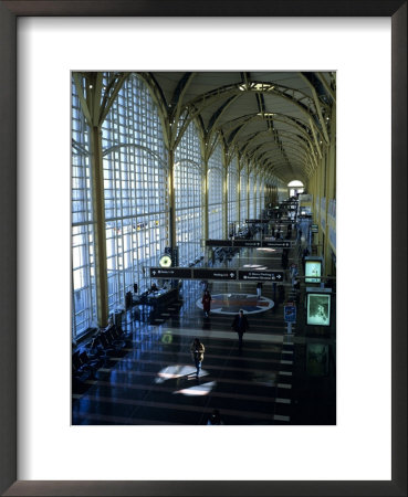 People Walk Through The Terminal Of Washington's National Airport by Stephen Alvarez Pricing Limited Edition Print image
