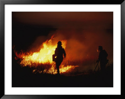 Firefighters Start A Controlled Fire On Prairie Land At Night by Joel Sartore Pricing Limited Edition Print image