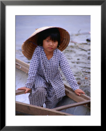 Girl In Canoe By Perfume River, Looking At Camera, Hue, Vietnam by Pershouse Craig Pricing Limited Edition Print image