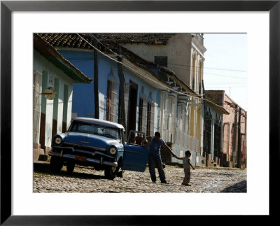 A Cuban Man Gets Out Of His Car With His Child by Javier Galeano Pricing Limited Edition Print image
