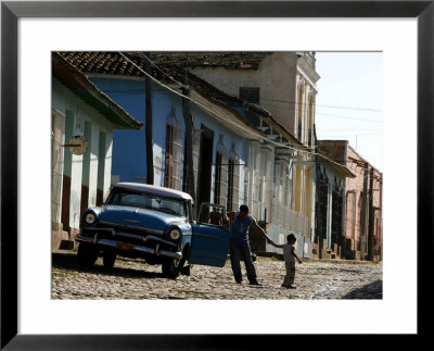 A Cuban Man Gets Out Of His Car With His Child by Javier Galeano Pricing Limited Edition Print image