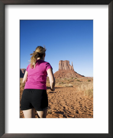 Woman Jogging, Monument Valley Navajo Tribal Park, Utah Arizona Border, Usa by Angelo Cavalli Pricing Limited Edition Print image