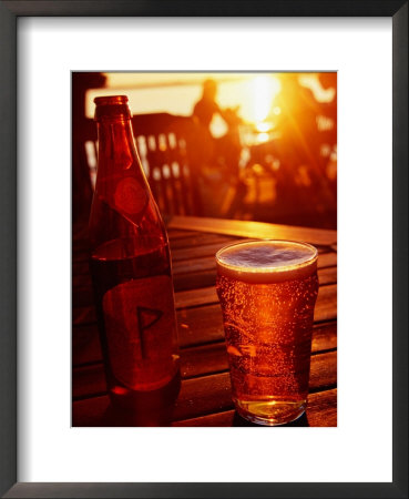 Bottle And Glass Of Beer By Lake Vattern At Sunset, Motala, Ostergotland, Sweden by Anders Blomqvist Pricing Limited Edition Print image