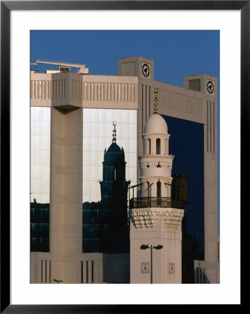 Traditional Minaret Reflecting In Batelco Building, Manama, Bahrain by Chris Mellor Pricing Limited Edition Print image
