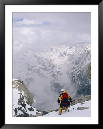 A Mountaineer Descends Near The Summit Of Grand Teton In Wyoming by Gordon Wiltsie Pricing Limited Edition Print image