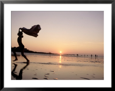 Silhouetted Girl Runs With Beach Towel, Ma by Kindra Clineff Pricing Limited Edition Print image
