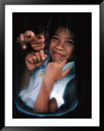 Young Balinese Boys Packed Into The Rear Of The Car Returning Home After Dance Practice, Indonesia by Adams Gregory Pricing Limited Edition Print image