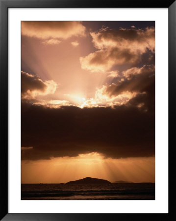 Rays Of Sunlight Break Through The Clouds At Sunset, Cape Le Grand National Park, Australia by Mark Newman Pricing Limited Edition Print image