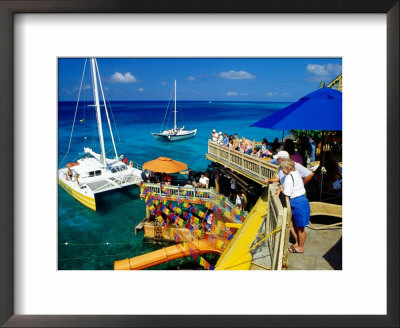 Catamarans Moored Outside Margaritaville Pub And Restaurant, Montego Bay, Jamaica by Richard Cummins Pricing Limited Edition Print image