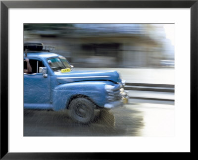 Panned Shot Of Old American Car Splashing Through Puddle On Prado, Havana, Cuba, West Indies by Lee Frost Pricing Limited Edition Print image