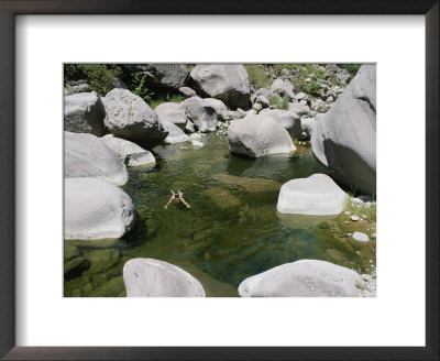 A Woman Swims In The Green Water Of The Sespe River by Rich Reid Pricing Limited Edition Print image
