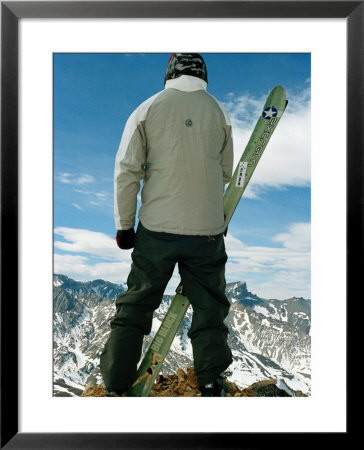 Skier Looking At The View Of Mountains At Las Lenas, Argentina by Christian Aslund Pricing Limited Edition Print image