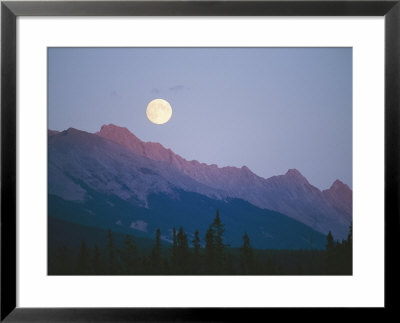 The Full Moon Over Mountains Lit By Low Sunlight by Raymond Gehman Pricing Limited Edition Print image