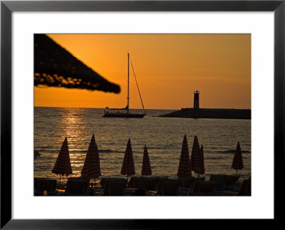Sunset On Sailboat, Lighthouse And Umbrellas, Kusadasi, Turkey by Joe Restuccia Iii Pricing Limited Edition Print image