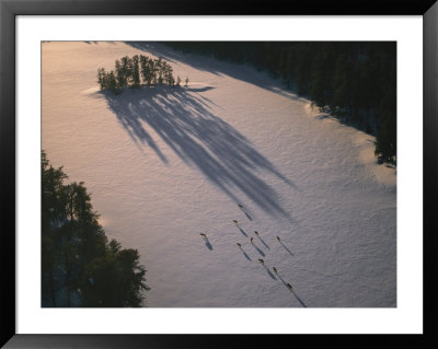 A Classic Adirondack Chair Is Silhouetted By A Lake In New York by Stacy Gold Pricing Limited Edition Print image