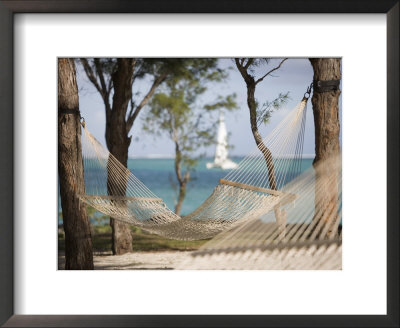 Beach Hammock With Catamaran In Background, Private Island Of Le Tuessrok Resort by Holger Leue Pricing Limited Edition Print image