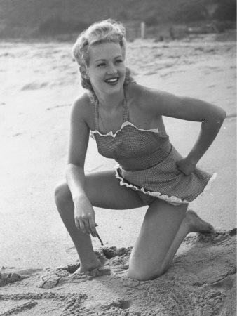 Betty Grable Posing In Bathing Suit by Peter Stackpole Pricing Limited Edition Print image
