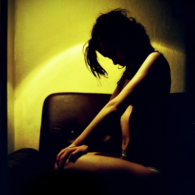 A Young Woman Sitting In The Dark by Jewgeni Roppel Pricing Limited Edition Print image