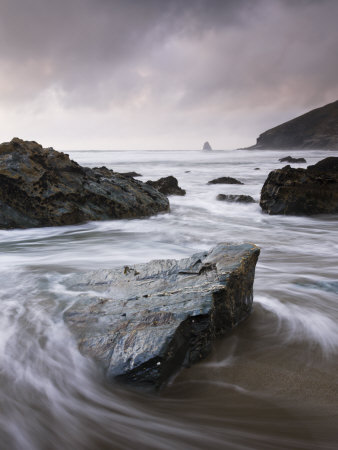 Incoming Tide Swirling Around Rocks On Tregardock Beach, North Cornwall, England, United Kingdom by Adam Burton Pricing Limited Edition Print image