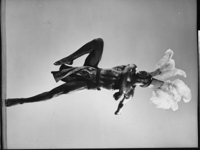 Dancer From Karamu House, Negro Social Settlement, Performing African Tribal Dance In Full Costume by Gjon Mili Pricing Limited Edition Print image