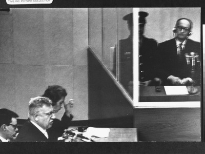 Defense Counsel Dr. Robert Servatius Addressing The Court As Nazi War Criminal Adolf Eichmann Sits by Gjon Mili Pricing Limited Edition Print image