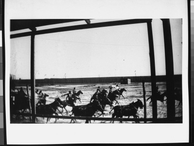 Indians On Horseback Attacking A Horse-Drawn Coach During Buffalo Bill's Wild West Show by Wallace G. Levison Pricing Limited Edition Print image