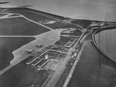 Aerial View Of Airport With Planes On Runway And Shannon River In Background by Nat Farbman Pricing Limited Edition Print image
