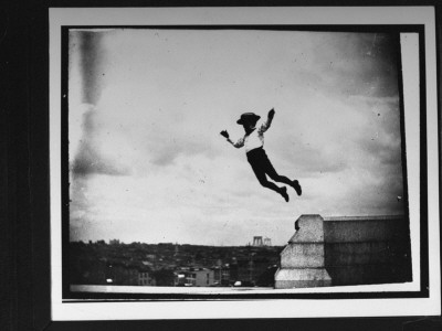 Young Jamie Swan Jumping Off A Short Stone Wall At Fort Greene by Wallace G. Levison Pricing Limited Edition Print image