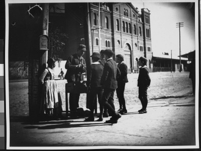 Young Boys Haggling With A Vendor, Trading Apples For His Chesnuts by Wallace G. Levison Pricing Limited Edition Print image