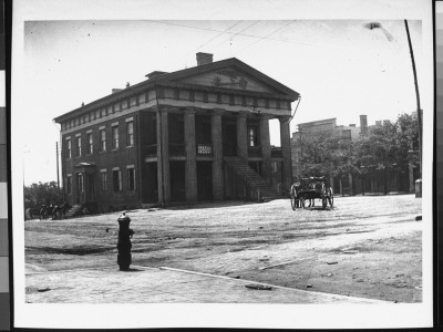 A Horse-Drawn Cart Passing The County Courthouse In Early Morning by Wallace G. Levison Pricing Limited Edition Print image