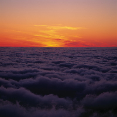 Red Sky By The Horizon, Above Clouds At Sunset by Throstur Thordarson Pricing Limited Edition Print image