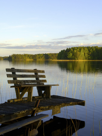 A Wooden Bench On An Old Landing By A Lake, Sweden by Berndt-Joel Gunnarsson Pricing Limited Edition Print image