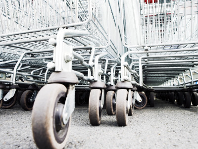 Wheels Of Shopping Trolleys In A Supermarket by Gunnar Svanberg Skulasson Pricing Limited Edition Print image