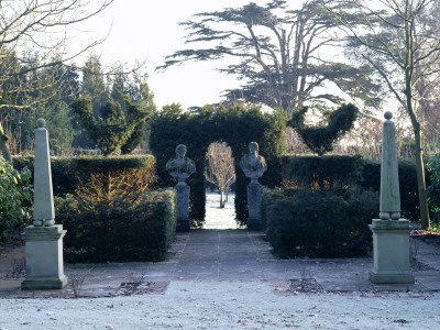 Gwent Garden - A Theatre Flanked By Two Obelisks, In Back Garden Is A Cedar Tree by Clive Nichols Pricing Limited Edition Print image