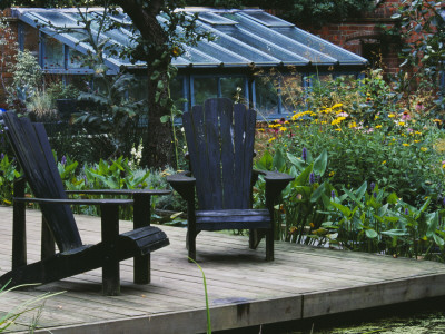 Decking Beside Lily Pool With Adirondack Chairs, Designer: Duncan Heather by Clive Nichols Pricing Limited Edition Print image