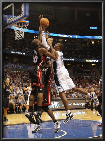 Miami Heat V Orlando Magic: Dwight Howard And Joel Anthony by Mike Ehrmann Pricing Limited Edition Print image