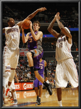 Phoenix Suns V Charlotte Bobcats: Goran Dragic And Derrick Brown by Kent Smith Pricing Limited Edition Print image