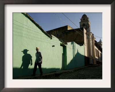 A Man Makes His Way Down Boca Street At The Historic Center Of Trinidad by Javier Galeano Pricing Limited Edition Print image