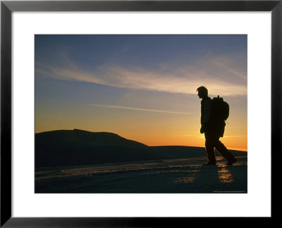 Walker Silhouetted At Sunset, Cairngorm National Park, Scotland by Mark Hamblin Pricing Limited Edition Print image