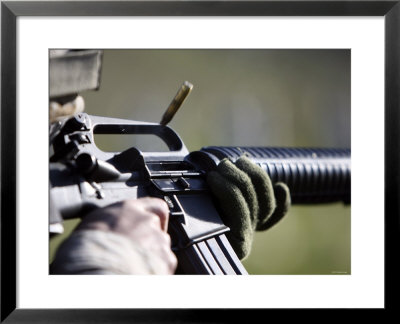A Round Flies From The Chamber Of An M-16A2 Service Rifle by Stocktrek Images Pricing Limited Edition Print image