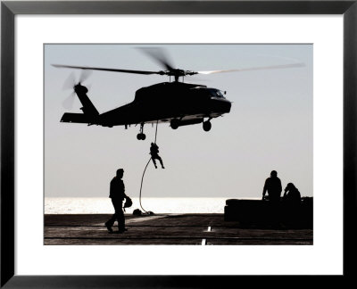 Personnel Fast-Rope Out Of An Sh-60F Seahawk Helicopter by Stocktrek Images Pricing Limited Edition Print image