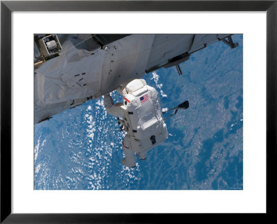 Mission Specialist Traverses The Station Hardware During Installation Day On The Space Station by Stocktrek Images Pricing Limited Edition Print image
