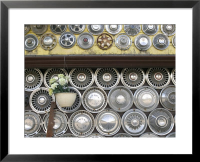 Automobile Hubcaps, British Columbia, Canada by Walter Bibikow Pricing Limited Edition Print image