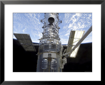 Astronauts Participate In Extravehicular Activity On The Hubble Space Telescope by Stocktrek Images Pricing Limited Edition Print image