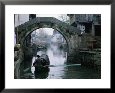 A Bamboo Boat Makes Its Way Through Shaoxing Water Town, Shaoxing, Zhejiang, China by Keren Su Pricing Limited Edition Print image