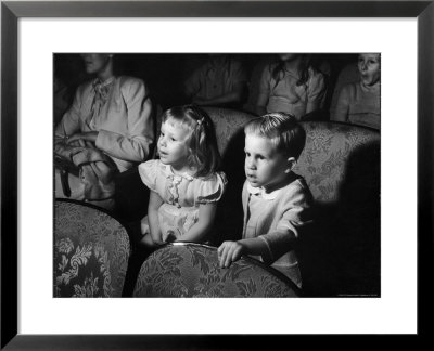 Children Watching Cartoons In A Movie Theater by Charles E. Steinheimer Pricing Limited Edition Print image