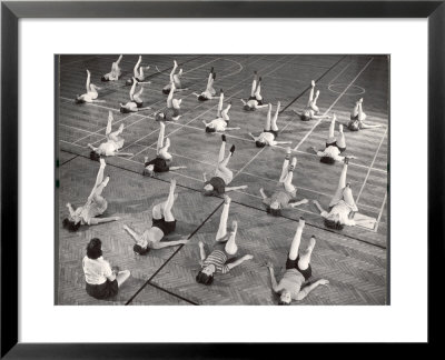 Girls And Women Doing Leg Exercise On Floor Of Metropolitan Life Insurance Company's Gym by Herbert Gehr Pricing Limited Edition Print image
